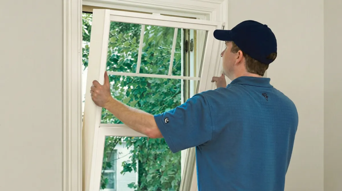 Professional contractors performing a residential window insulation and replacement service in Omaha, NE